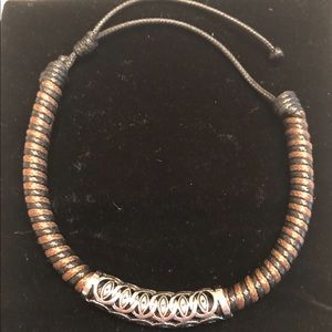 NWOT woven bracelet with metal detail